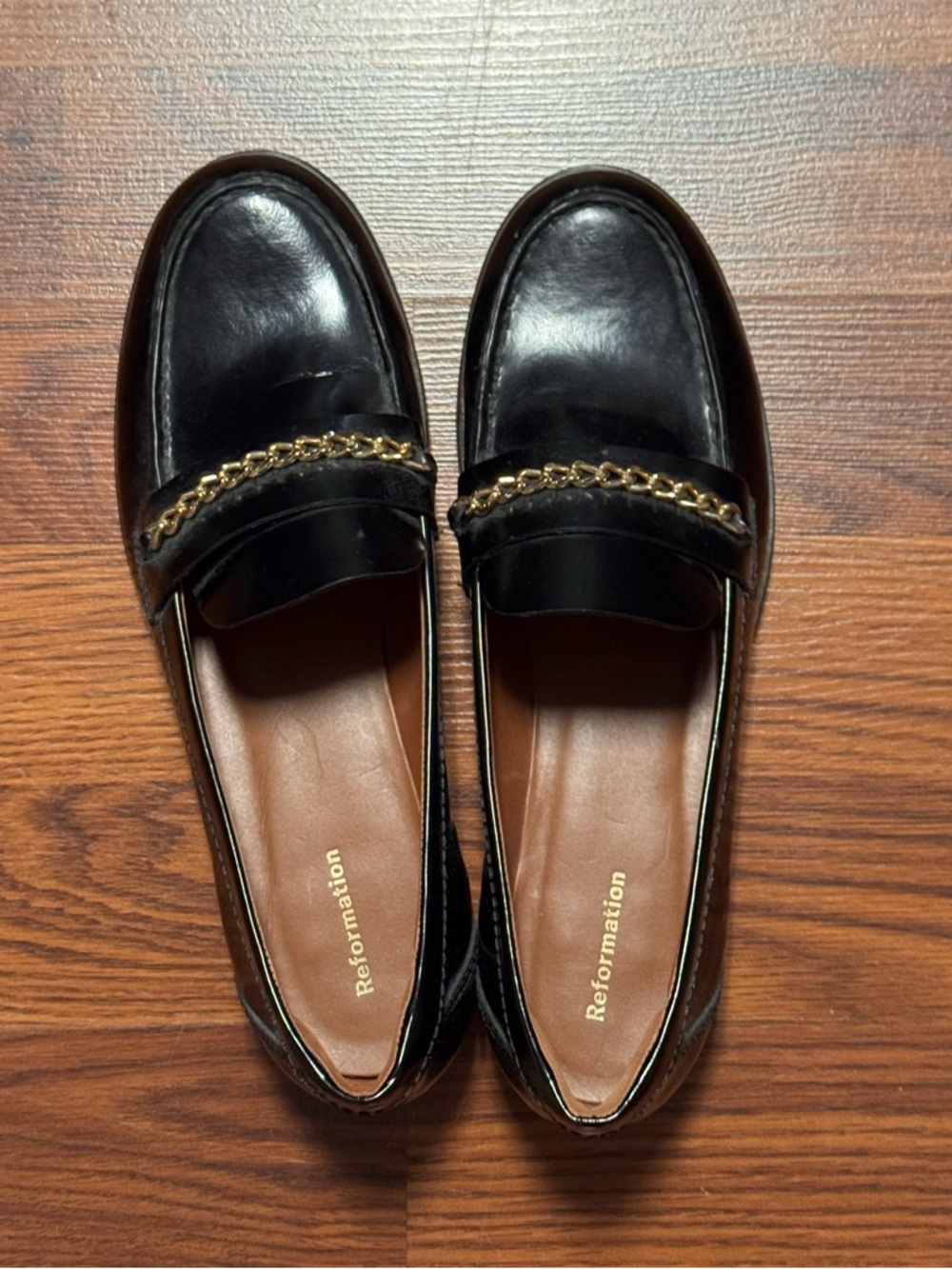 Reformation Black Leather Loafers with a gold chain